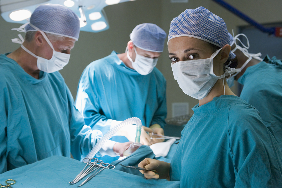 bigstockphoto_Four_Surgeons_Getting_Ready_To_5122640